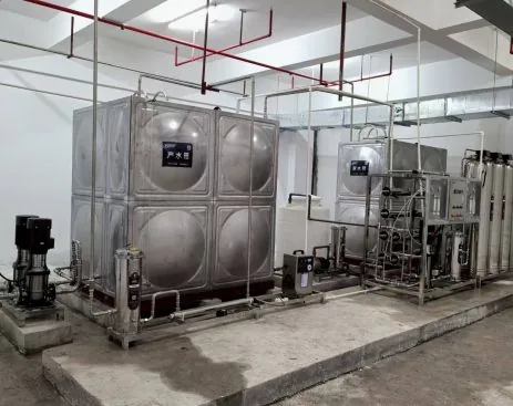 Stainless storage tanks, pumps and treatment skid used to illustrate a public-facility water system